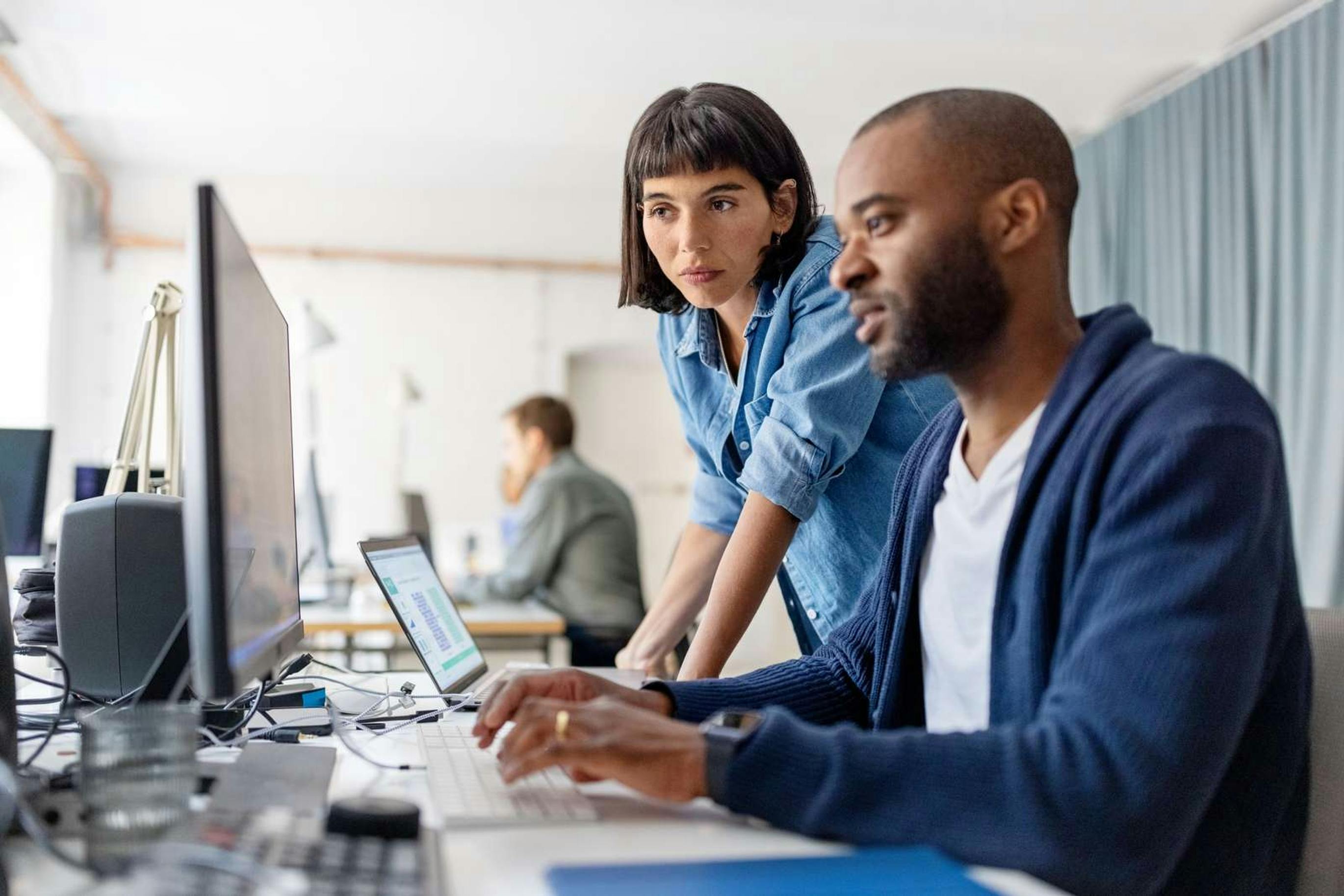 Man by computer at work